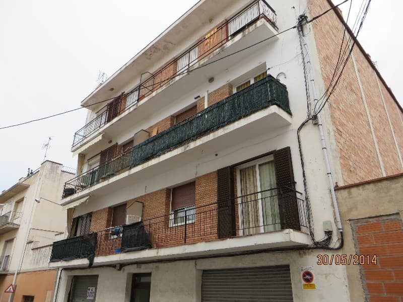 URBANA. NUMERO SIETE. Piso primero, puerta tercera, de la casa sin numero, actualmente número 9-11, de la calle Cervantes, del término municipal de Sant Feliu de Guíxols; se compone de recibidor, cuatro habitaciones, comedor, cocina, cuarto de aseo,