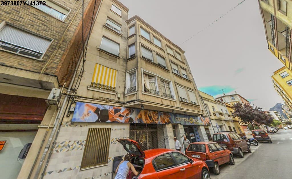 URBANA: PLANTA BAJA, destinada a local comercial y almacén, del edificio situado en Gandía, Avenida de Beniopa, número veintitrés, que ocupa una superficie de quinientos setenta y cuatro metros con setenta decímetros cuadrados. Linda con generales de - Imagen 1