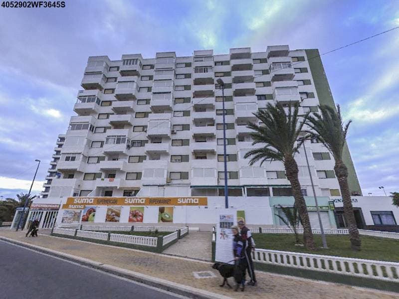 Descripción de la finca: URBANA: APARTAMENTO EN PLANTA ALTA SEPTIMA, señalado con el número OCHENTA de los elementos individuales del Edificio, denominado OLIMPIA compuesto de planta baja y diez altas, conocido por Bloque A, de la parcela E-28 y 29 e - Imagen 1